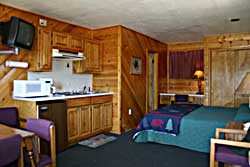 Sample bedroom with pine paneling